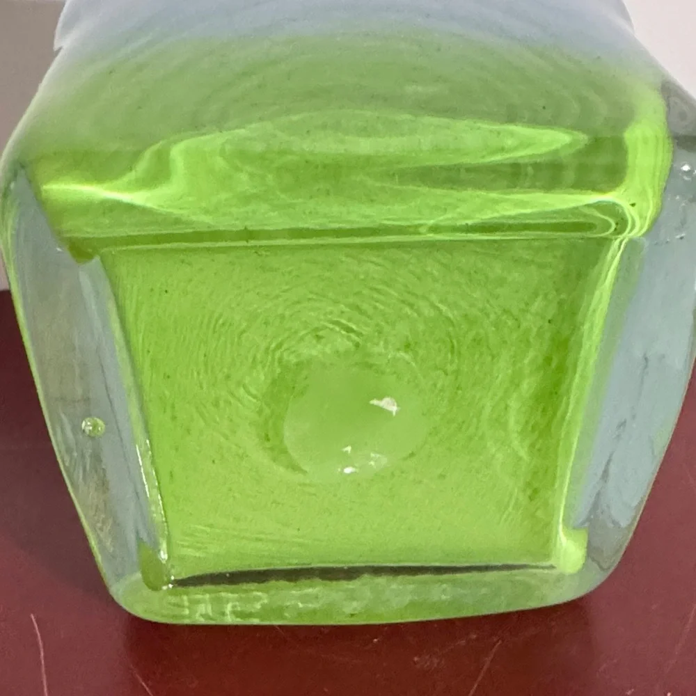 Hand-blown art glass vase with a light blue and green gradient color scheme